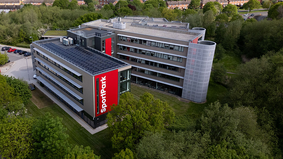 An aerial view of the SportPark building surround by trees