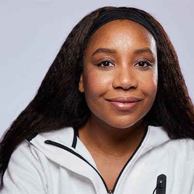A headshot of Angela with a plain background, a member of the Alumni Advisory Board at Loughborough University