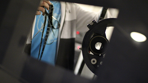 Someone at a film reel