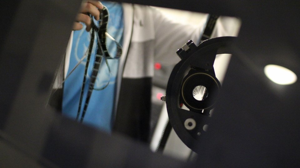 Someone at a film reel