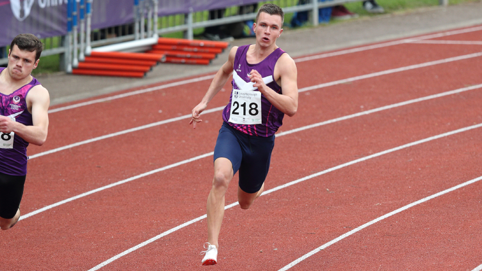 An image of Chris Main sprinting on a track