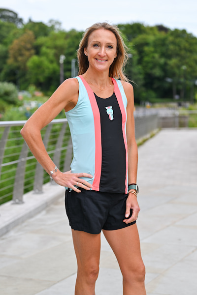 Paula Radcliffe standing wearing athletic clothing