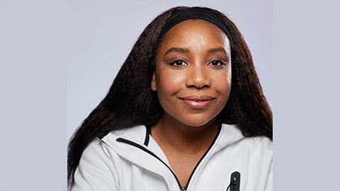 A headshot of Angela with a plain background, a member of the Alumni Advisory Board at Loughborough University