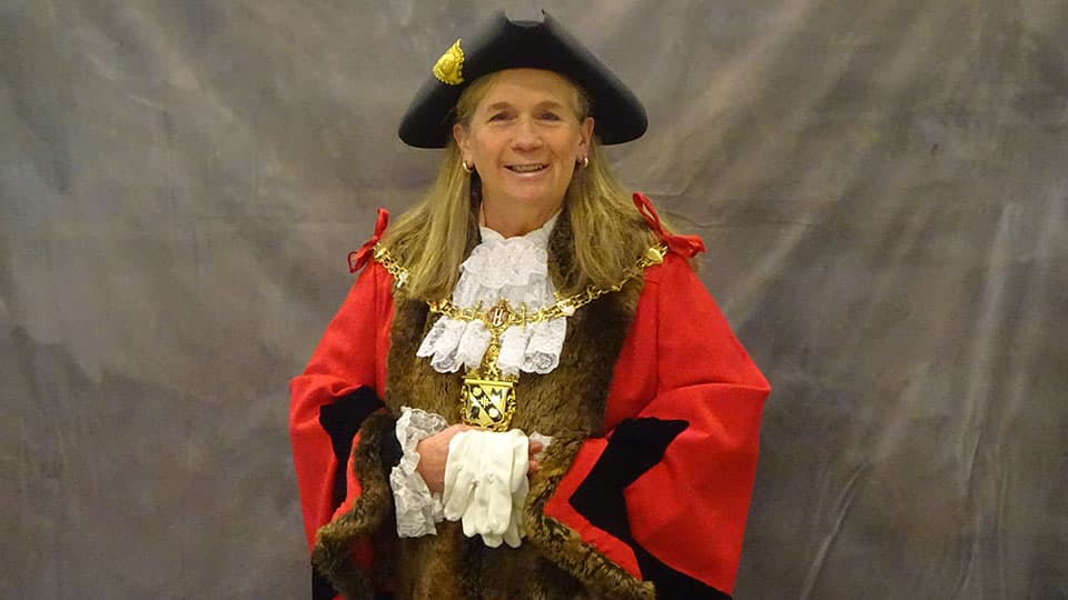 Dr Julie Bradshaw MBE wearing the Charnwood Mayoral robe