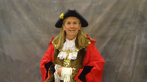 Dr Julie Bradshaw MBE wearing the Charnwood Mayoral robe