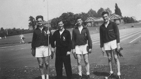 Four people standing together in sportswear at Loughborough. Jim is third from left.