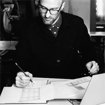 Nick Munn working at a desk, designing