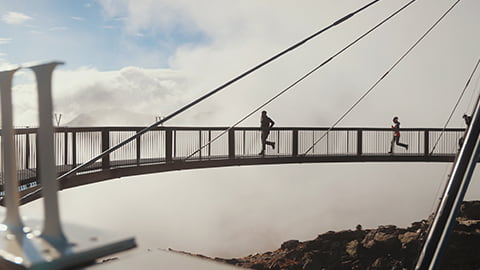 People on a large bridge running