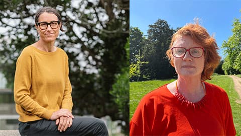 A headshot Virginia Braun and Victoria Clarke. Virginia is sitting down with her hands in her lap and she is wearing a yellow jumper and grey trousers while smiling at the camera. Victoria is stood outside near some trees and the sun is shining. She is wearing an orange top, necklace and glasses and is smiling at the camera.