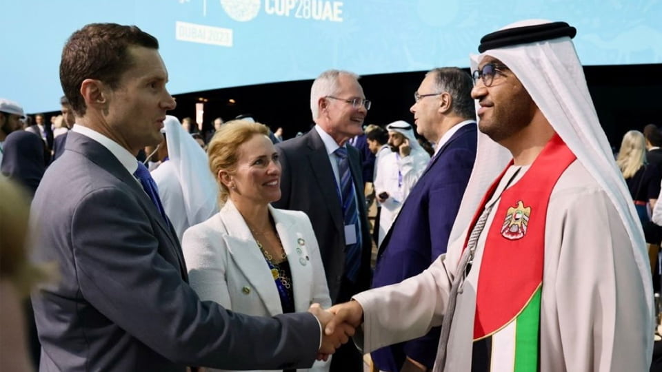 Bruce shaking hands with someone