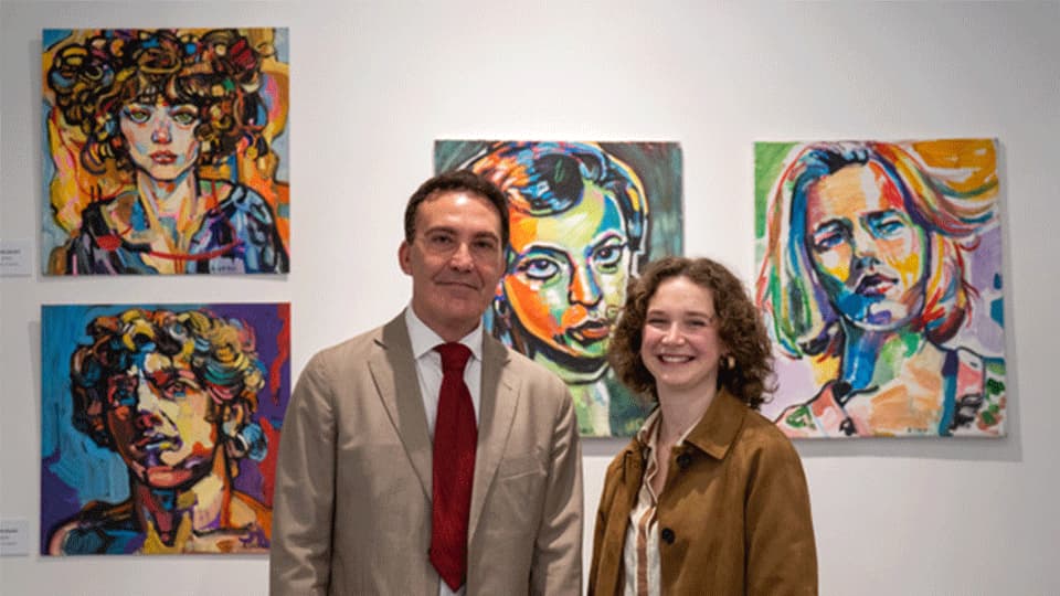 Aaron Soleci standing in front of his artwork with Monica Popham at Gallery Kent, Tangier.