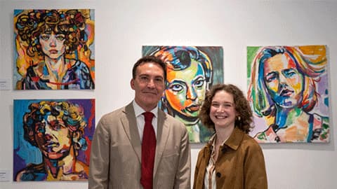 Aaron Soleci standing in front of his artwork with Monica Popham at Gallery Kent, Tangier.