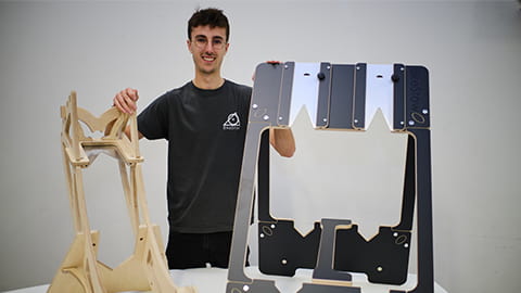 George Laight stands with the Bike Stow