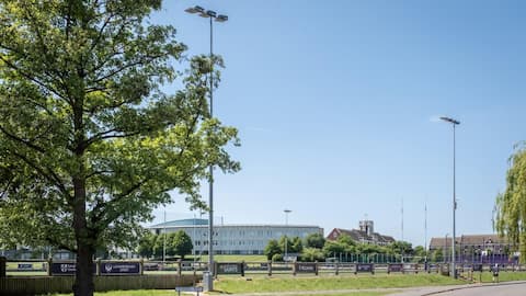 A view of the rugby pitch and buildings in the background