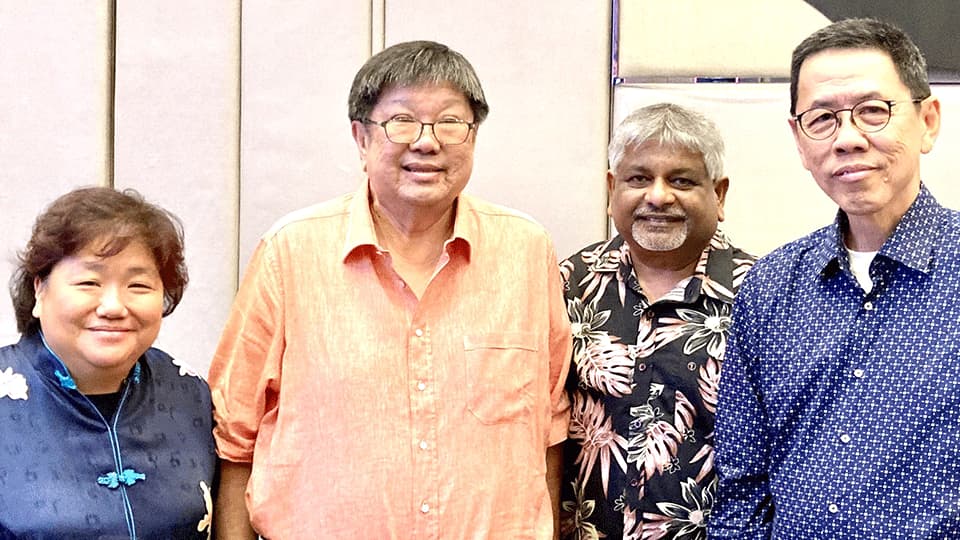 Thiat Wong, Cheng Lee, Budhi Sentoso and Viyasan Krishnan standing together and smiling.