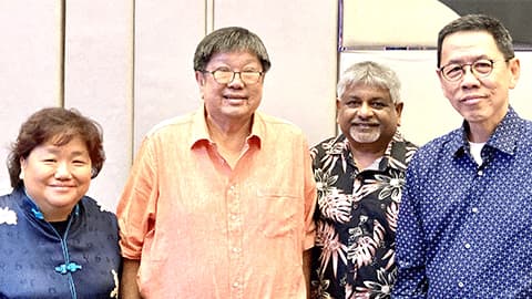 Thiat Wong, Cheng Lee, Budhi Sentoso and Viyasan Krishnan standing together and smiling.