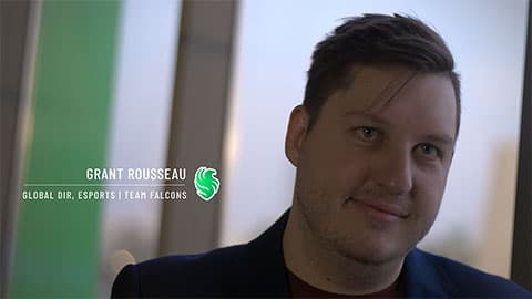 Grant Rousseau speaking to the camera being filmed for the Amazon documentary with the text Grant Rousseau, Global DIR, Esports, Team Falcons in white text overlapping the image but to the side so you can see his face.
