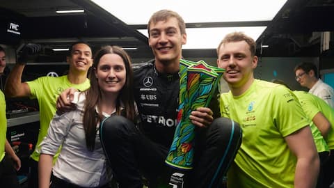 F1 driver George Russell with Holly and others