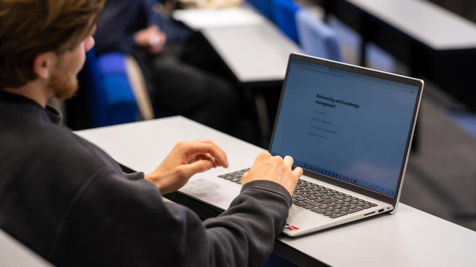 A student working on a laptop