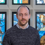 A head shot of Ben Adcock