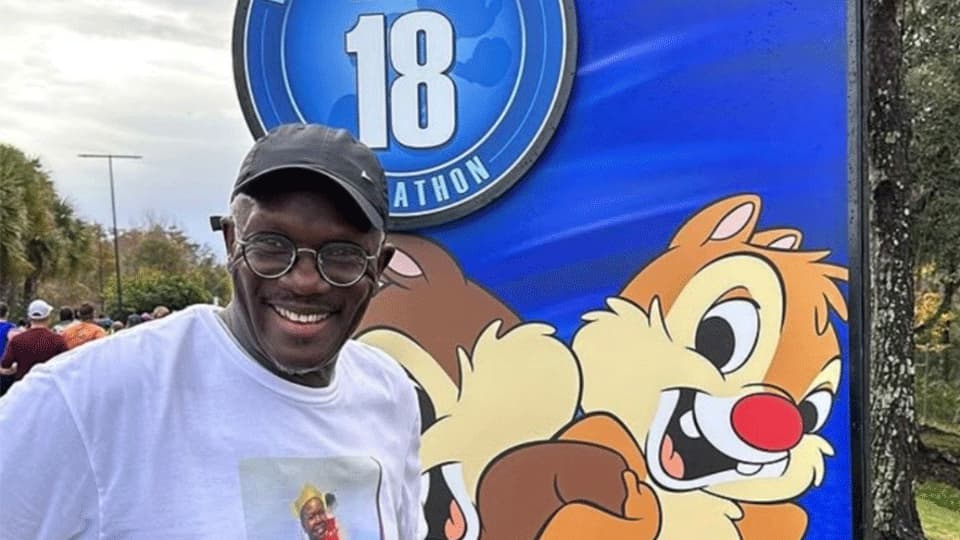 Edward in his running gear smiling at the camera.