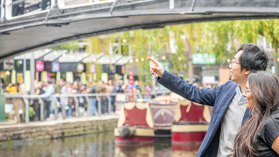 two people beside a canal
