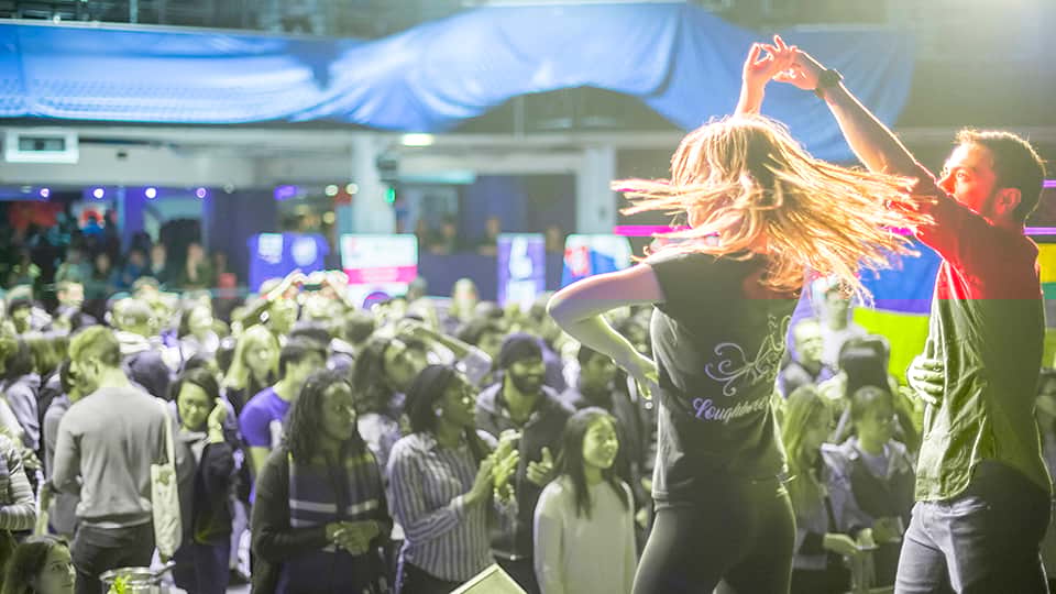 people on stage and crowds inside the Students' Union