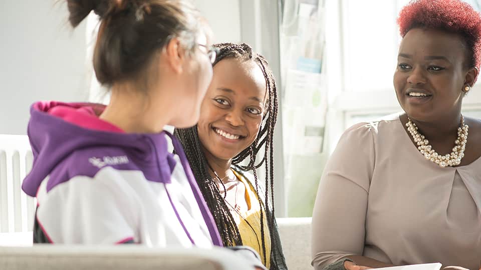 three people talking