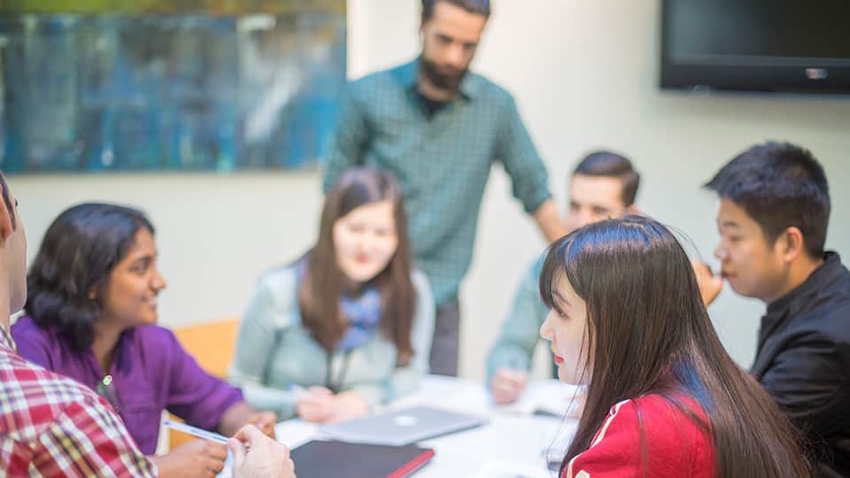 a group of people in a seminar room