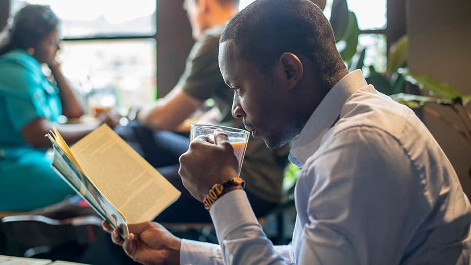 a man reading in a cafe