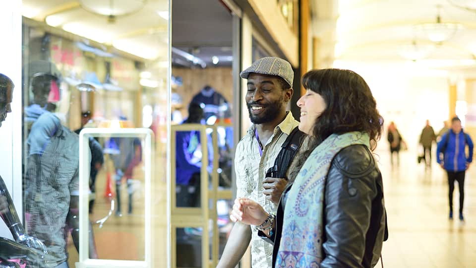two people looking in a shop window