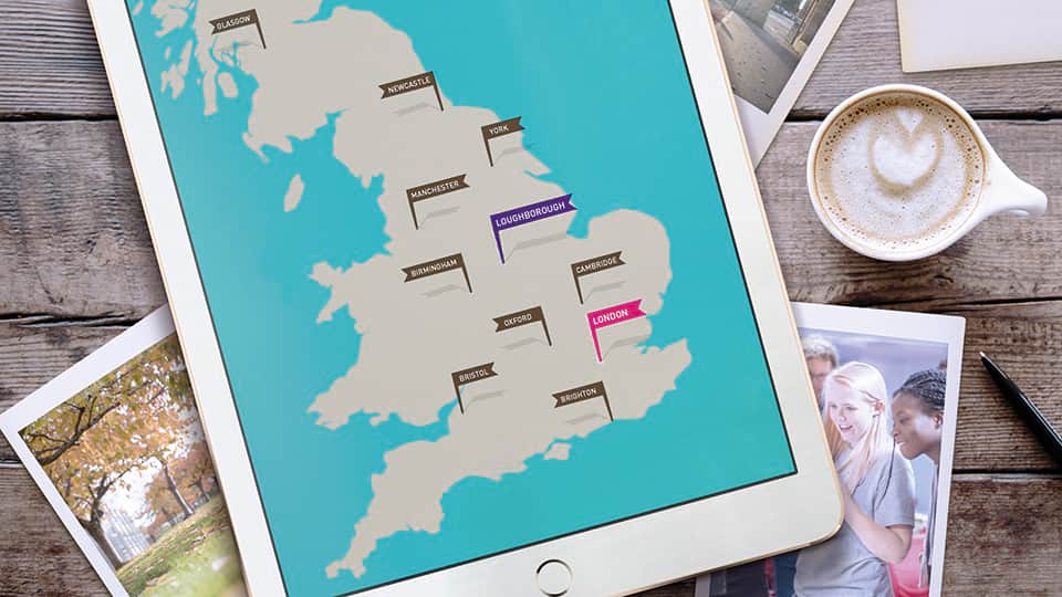 items on a table including a tablet showing a map of southern England with locations of Loughborough University and Loughborough University London
