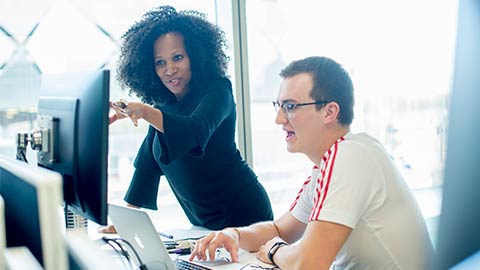 Loughborough University London academic talking to student