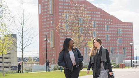 Two students walking near student accommodation in London