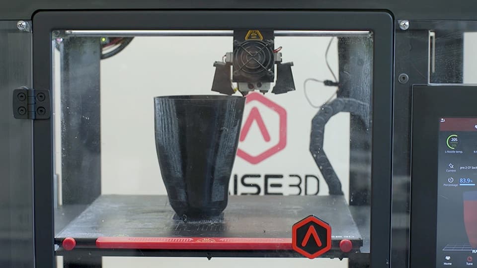 A 3D printer with a lower limb prosthetic socket inside of it