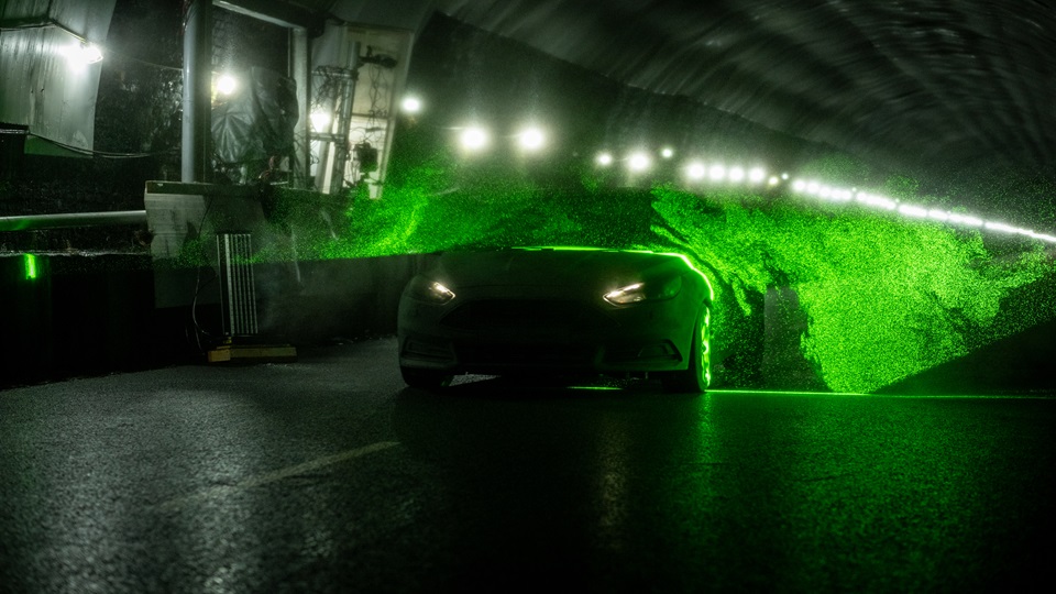 A car drives through a bubble screen during aerodynamic testing at Catesby tunnel