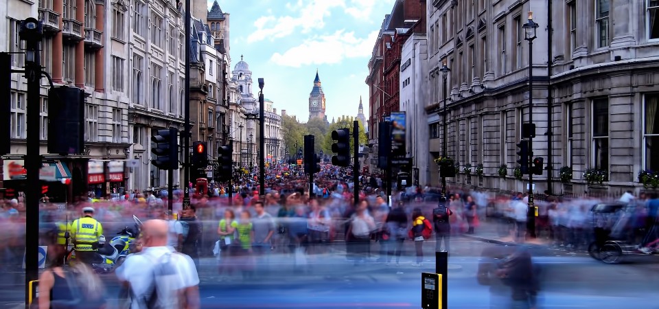 A busy London street with Big Ben in the distance