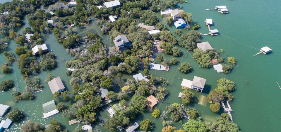 An aerial view of Austin, Texas, flooded with homes badly affected.