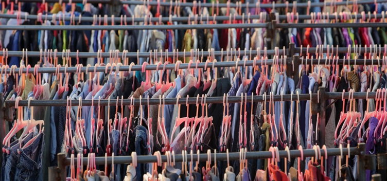 hundreds of clothes on hangers