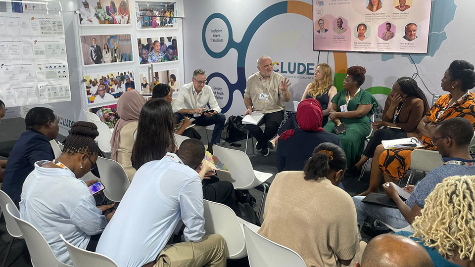 A group of people listening in a classroom
