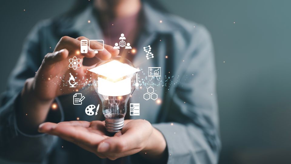 A woman is holding a light bulb with images around it signifying education and new ideas.