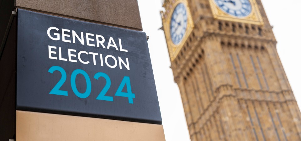 A sign saying General Election 2024 and Elizabeth Tower in London