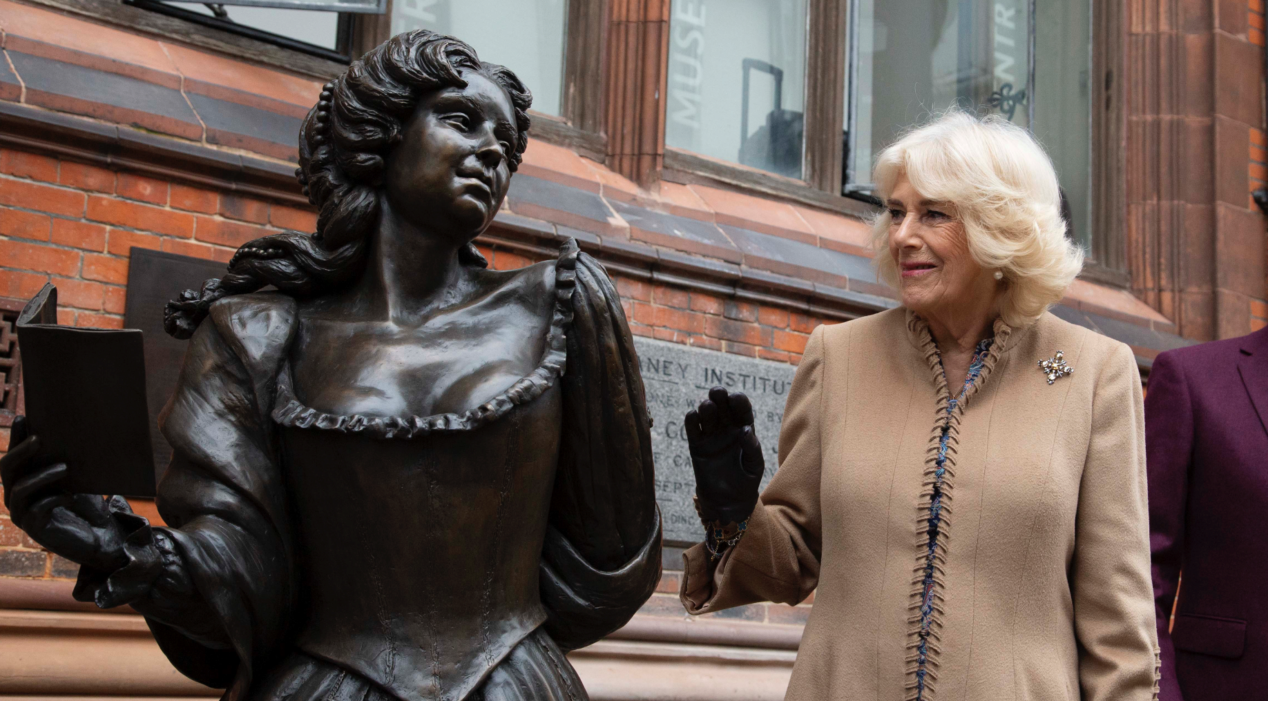 Queen Camilla next to statue of Aphra Behn
