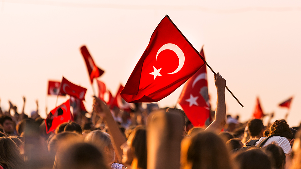 Turkish flag being held up in crowd