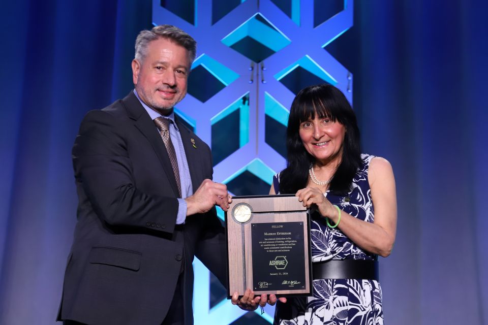 Professor Mahroo Eftekhari is presented with her Fellowship by ASHRAE President Bill McQuade