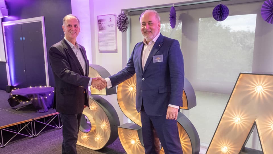 Chris Gill is shaking hands with the University Vice-Chancellor, Professor Nick Jennings