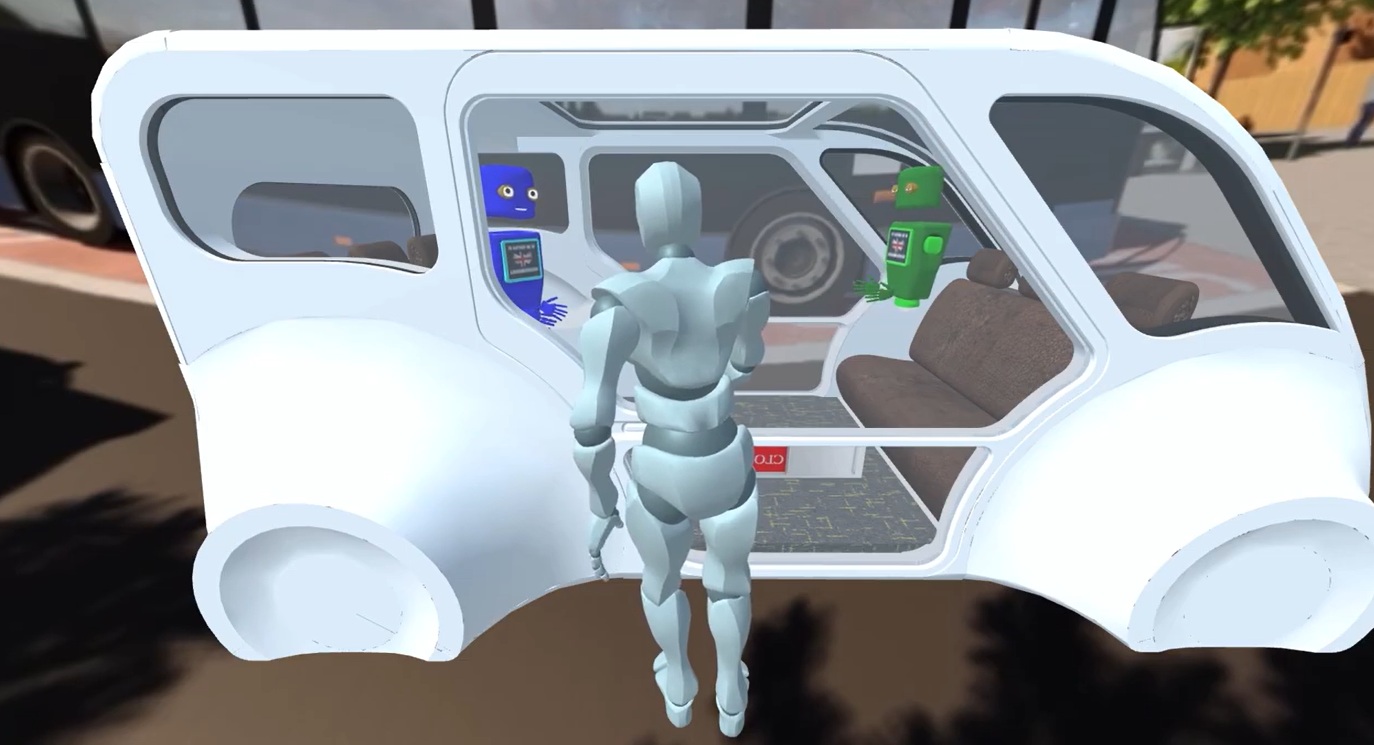 A VR scene of a small autonomous-style vehicle showing a bench seat inside. A grey humanoid figure stands at the doorway facing into the vehicle. Two cartoon-like robot characters—one blue and one green—are displayed on interior screens or panels, appearing to interact with the passenger. A large bus and city street elements are visible blurred in the background.