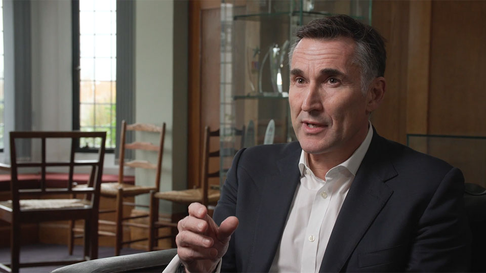 Steve Varley sitting being interviewed