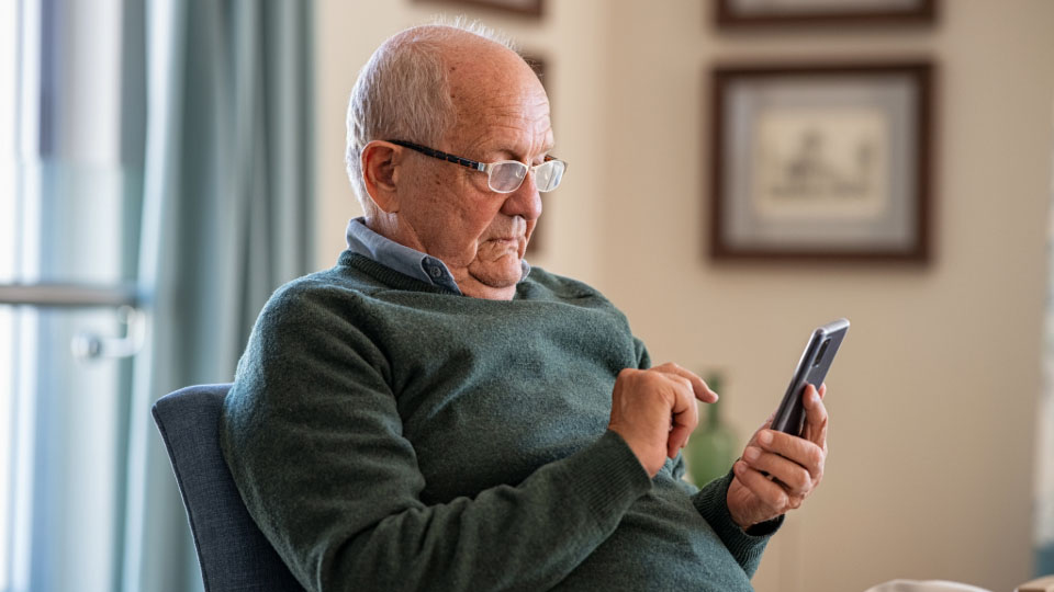 An old man on his phone