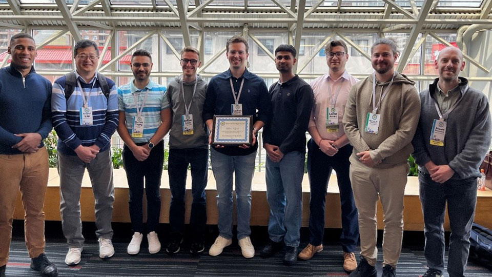 members of the CREST delegation at IEEE PVSC 2025 stood in a row